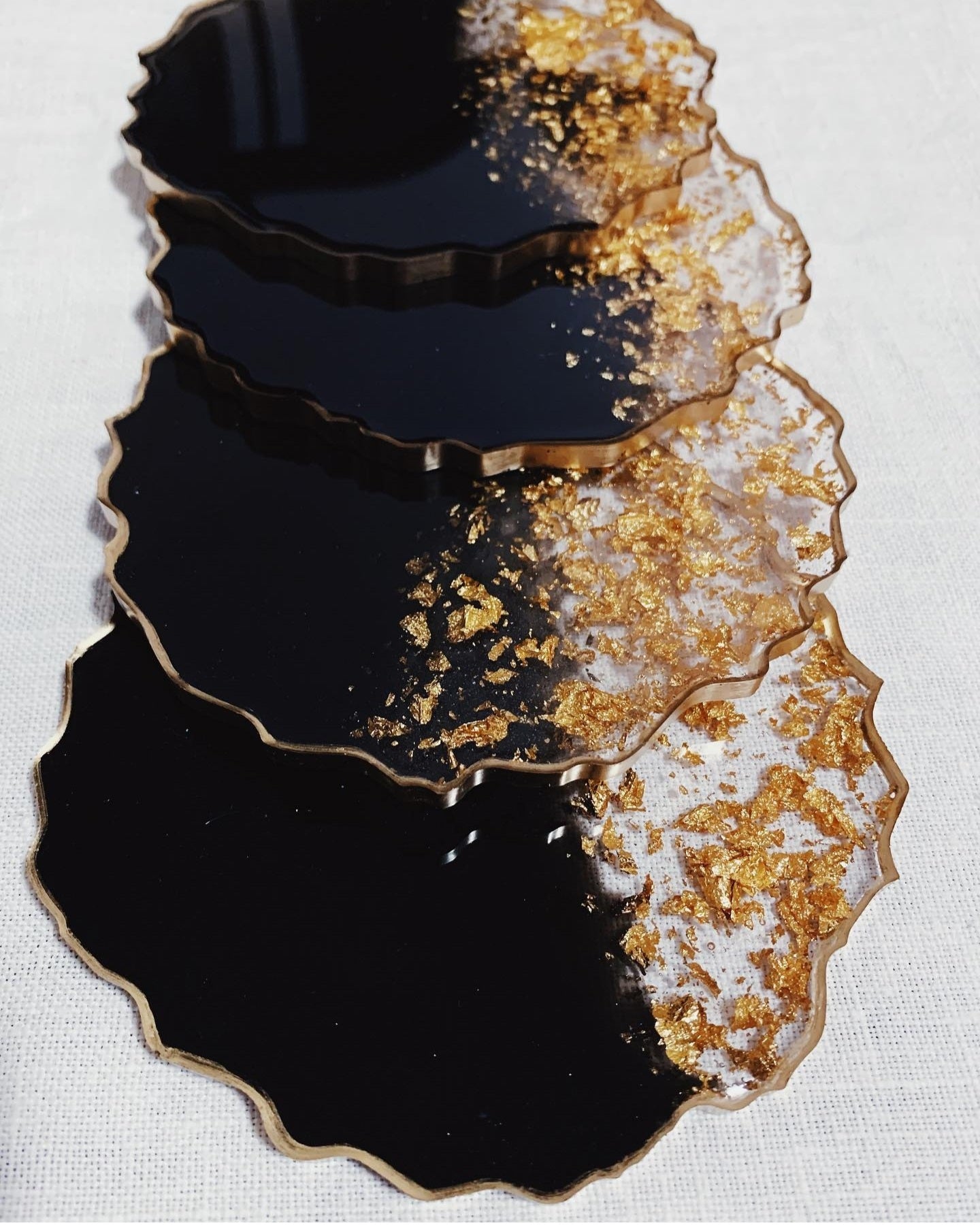 Black Pearl Radiance: Individual Black Resin Coaster with Gold Leaves & Gilded Edges - Geode Shape - 5in
