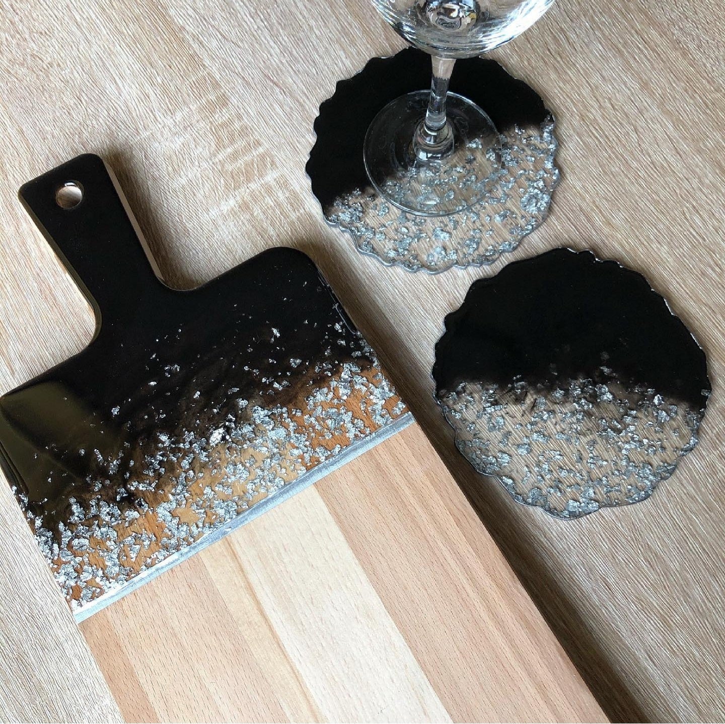 Black Pearl Radiance: Individual Black Resin Coaster with Silver Leaves - Geode Shape - 5in