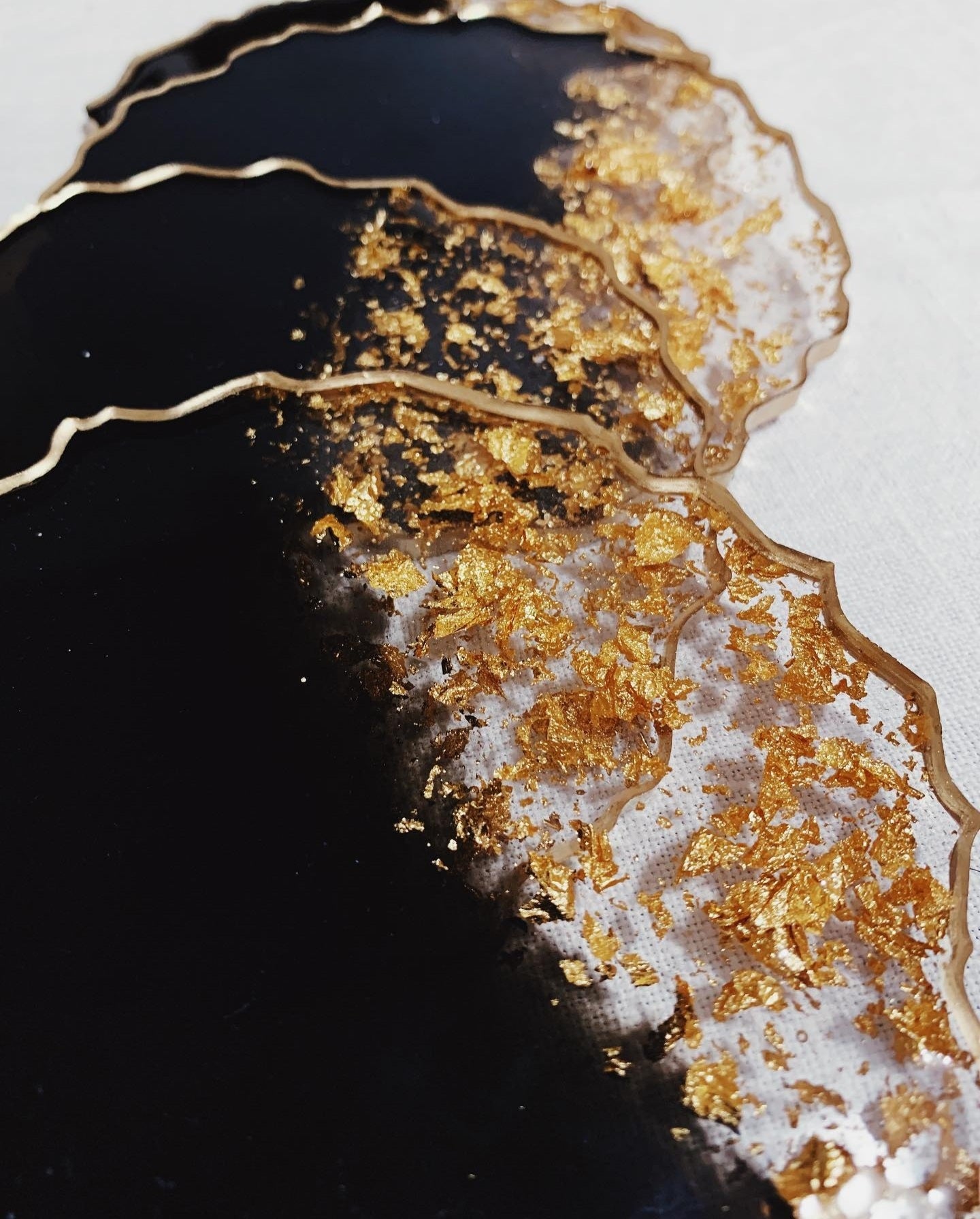 Black Pearl Radiance: Individual Black Resin Coaster with Gold Leaves & Gilded Edges - Geode Shape - 5in