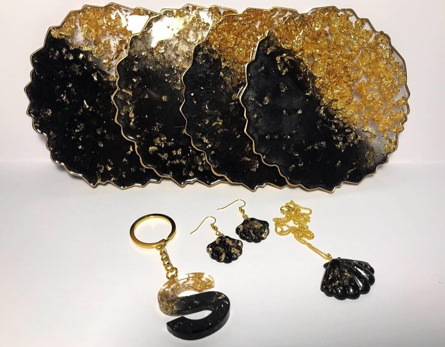 Black Pearl Radiance: Individual Black Resin Coaster with Gold Leaves & Gilded Edges - Geode Shape - 5in